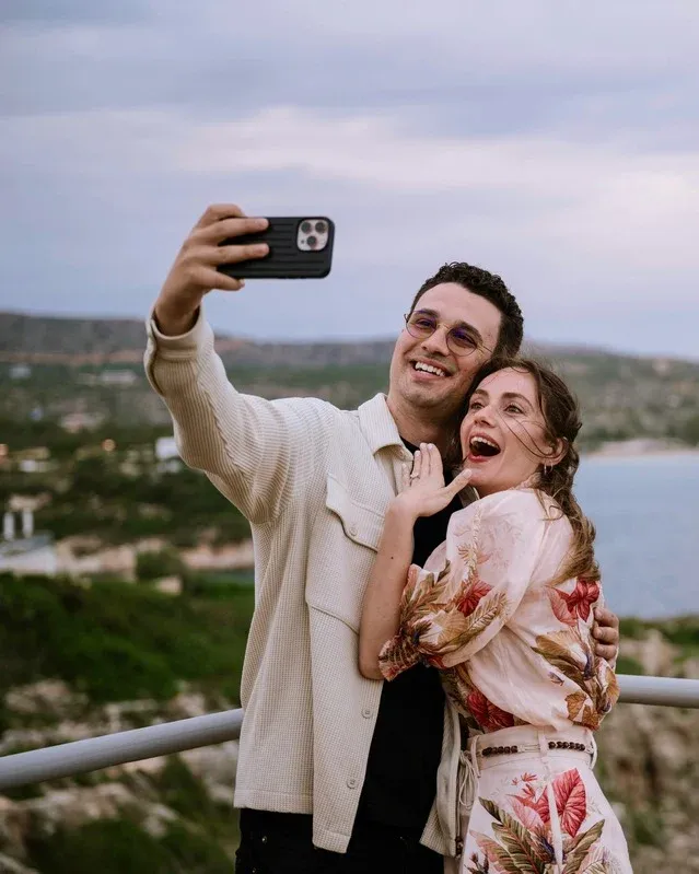 Morgan and Spencer taking a selfie on the coast