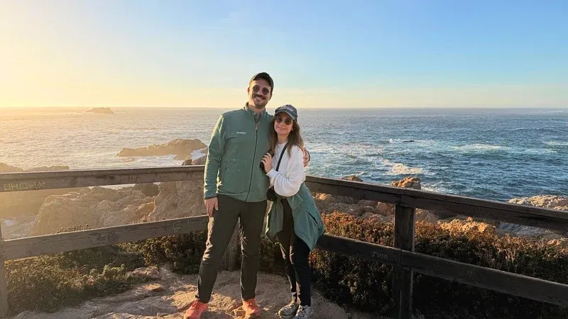 Morgan and Spencer at an ocean overlook at sunset