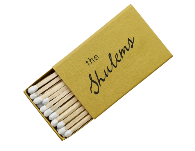 A matchbox that reads 'the Shulems'